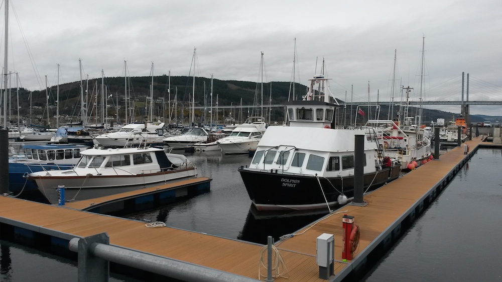 2 a boat docked at a dock