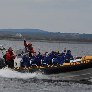 a group of people on a boat in the water