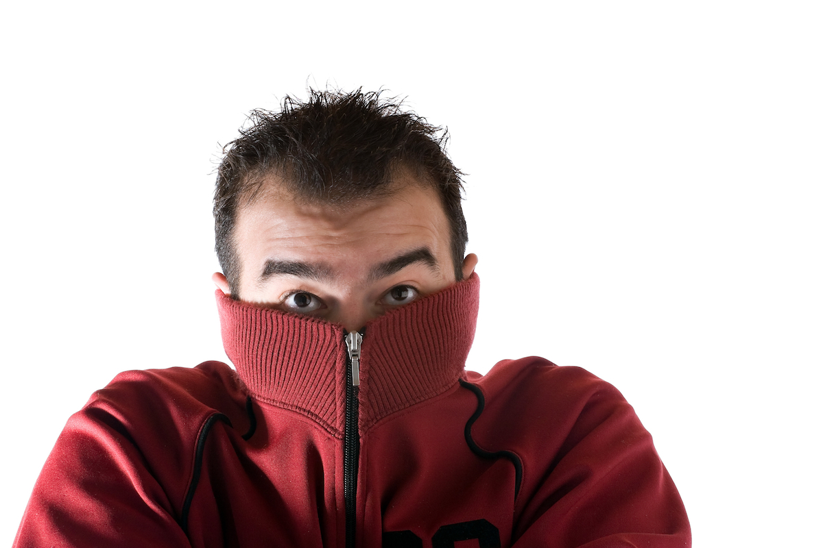 Cold Shivering Man a man wearing glasses