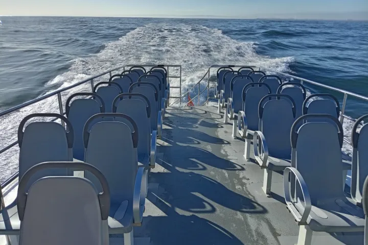 a chair next to a body of water