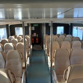 a room filled with furniture and a large window